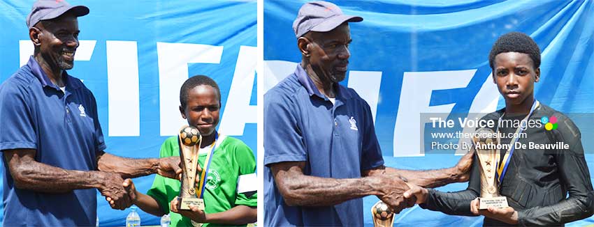 Image: (L-R) SLFA Events and Competition Coordinator, Evastus Augustin presenting the Northern United All Stars captain and FLOW Lancers FC goalkeeper with the championship and second place trophy, respectively. (PHOTO: Anthony De Beauville)  
