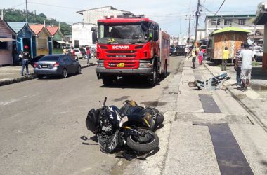 Image of a motorcycle on the road after accident.