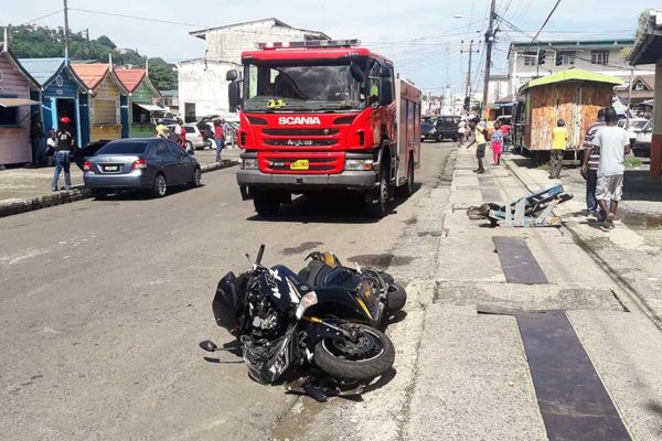 Image of a motorcycle on the road after accident.