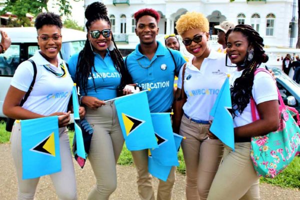 Image: Some of the bright faces representing Saint Lucia in Trinidad.