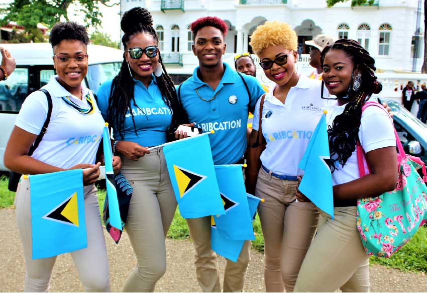 Image: Some of the bright faces representing Saint Lucia in Trinidad.