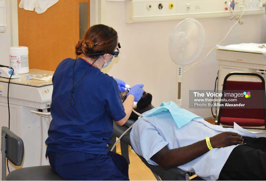 Image of dental procedure being done at humanitarian mission clinic at OKEU.[Photo: Allen Alexander] 