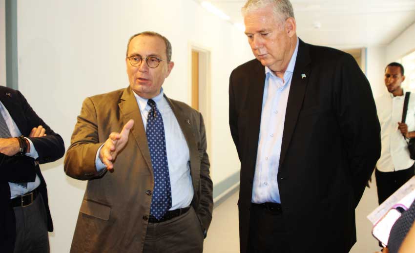 iMAGE: European Union Commission Director General for International Cooperation and Development, Stefano Manservisi, with Prime Minister Allen Chastanet during the walk through at Owen King.