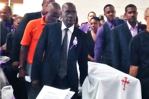 Image of media personality Harold George being laid to rest