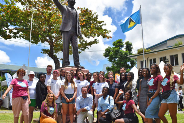 Image: Marine Science students (centre), with Geography and Psychology students; British High Commissioner, Steve McCready and Caribbean Elective representatives Harry Spear and Matt Barry at Constitution Park, Castries.