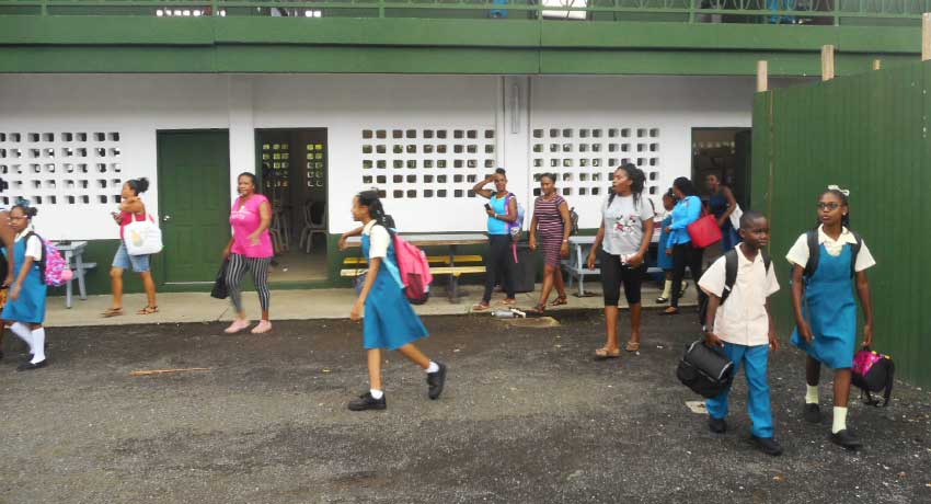 Image of parents and students leaving the school.
