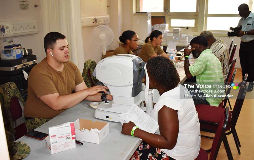 Image of patients in optometry at the USNS Comfort humanitarian mission clinic at OKEU. [Photo: Allen Alexander]