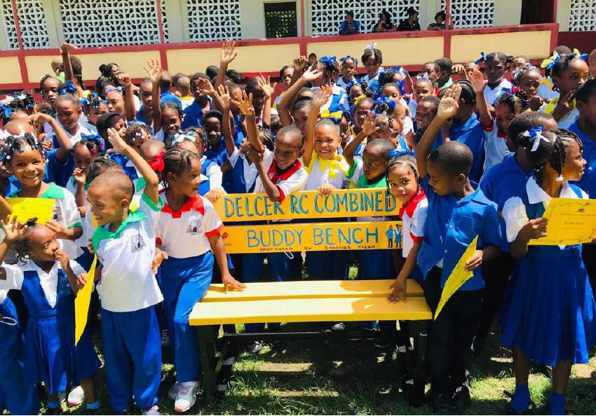 Image of students of the Delcer RC Combined School with their Buddy Bench.