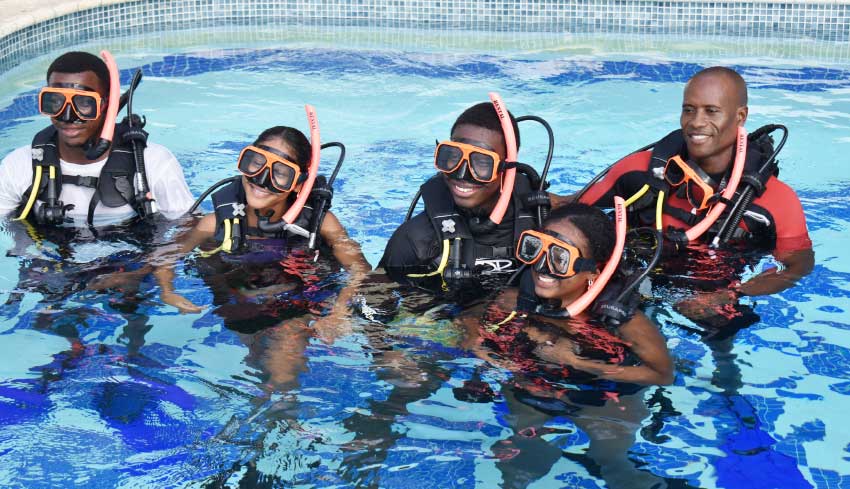 Image: Students with Dive Instructor Simeon Medard (far right).