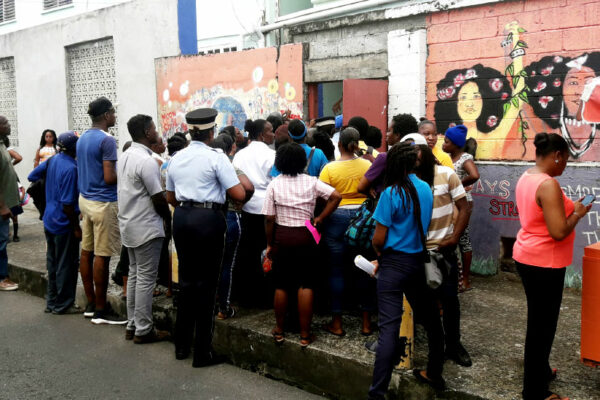 Image: A crowd of parents outside the Ave Maria Girls’ Infant School on Monday.