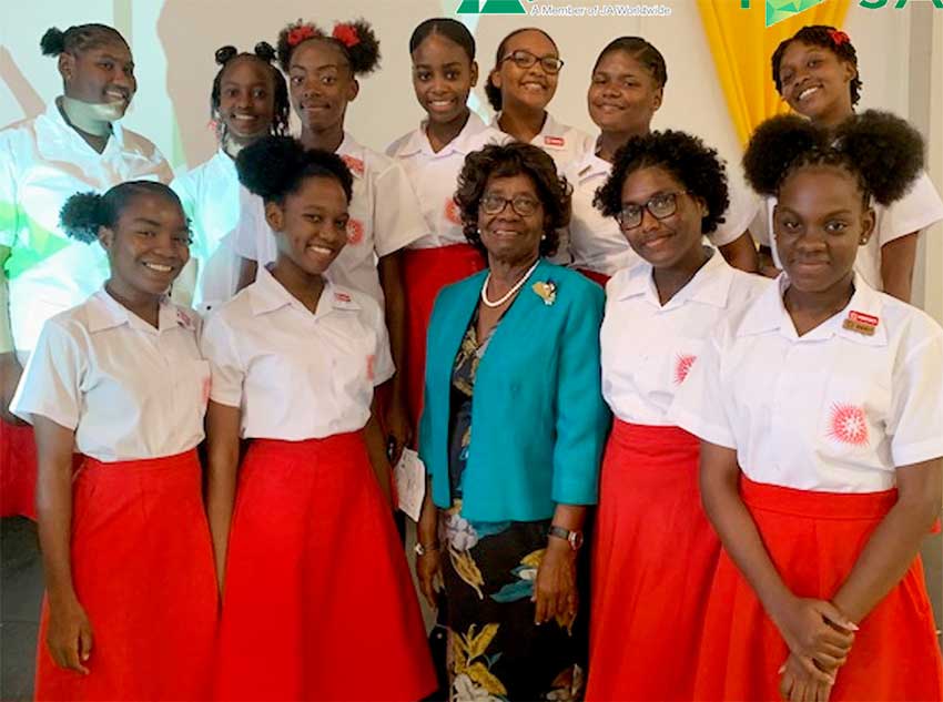 Image: Patron of Junior Achievement Her Excellency Dame Pearlette Louisy with CCSS students. 