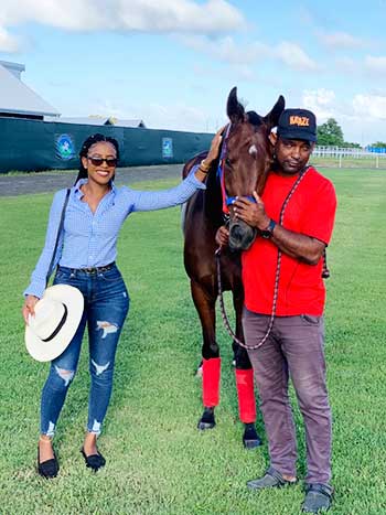 Image of Lily Thomas With Trainer Marvin Campbell And Queen Lily At The Royal Saint Lucia Turf Club.