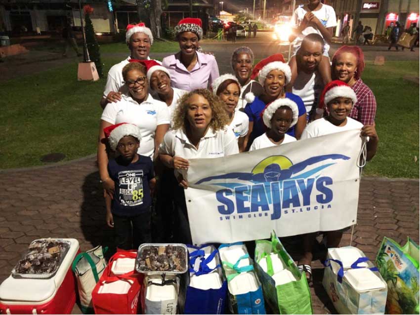 Image: Seajays sharing the Christmas cheer with the less fortunate in Castries. (Photo: SJ)