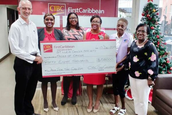 Image: Dr. Stephen King of St Lucia Cancer Society, Tia Henry, Smerna Pompelis & Ladesa James – Williams of CIBC FirstCaribbean, and Stevensia Theophane of VP Faces of Cancer.