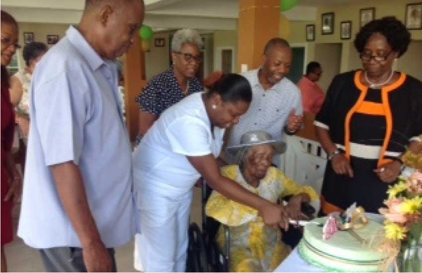 Image: Resident Martha’s 102nd Birthday with then Governor General Dame Pearlette Louisy. 