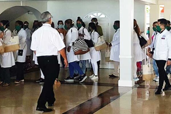 Image of Cuban doctors arriving at Sandals Regency La Toc Golf Resort & Spa.