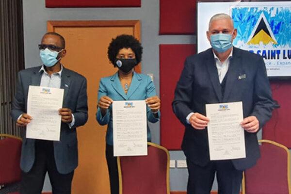 Image: From left to right, Opposition Leader Philip J. Pierre, Recover St. Lucia Chairperson Karen Peter and PM Allen Chastanet holding up signed copies of an MOU on the initiative.