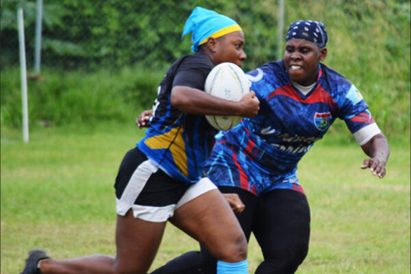 Image: Renetta Fredericks (Rogues) with ball in hand is challenged by Senetta Viger (Whiptail Warriors). (PHOTO: Anthony De Beauville)