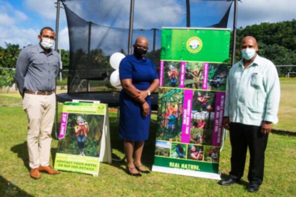 Image of From L-R, Raymond, Education Minister Rigobert and District Rep. Joseph.