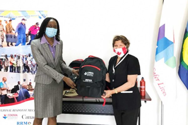 Image: CDEMA Executive Director (Ag.) Elizabeth Riley (left) receives a Deployment Package from the High Commissioner to Canada, Lilian Chatterjee
