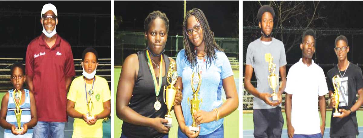 (L-R) Boys Under 9 champions and losing finalist Kimari Felix and Armani Rosemond received their award from tennis coach, Ron Blanchard; Girls Under 15 champion and losing finalist Iyana Paul and Latoya Murray; Boys Under 15 champion and losing finalist Jonas Sylvester and Mc Carvy Cyril received their trophies from Junior tennis player Thaddeus Emile. (Photo: Anthony De Beauville)