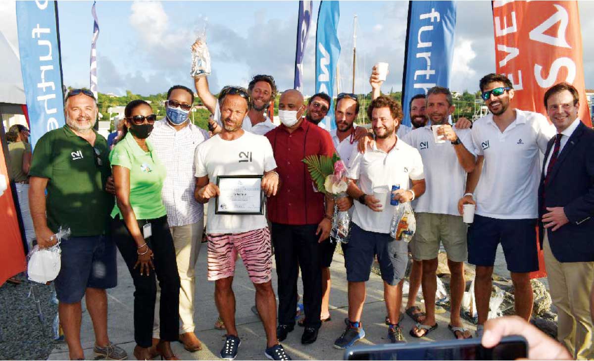 A photo moment for crew members of 12 Nacira 69, ARC officials, Minister, Ernest Hilaire, Events Saint Lucia CEO Lauren Sidonie and Tourism Authority Chairman, Thaddeus Antoine. (Photo: Anthony De Beauville)
