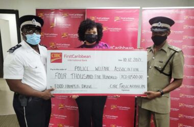 CIBC presents cheque to executives of the RSLPF Welfare Association towards 13 annual care drive.