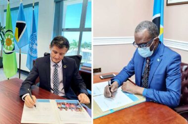 [L-R] Mr. Didier Trebucq & Prime Minister, Hon. Philip J. Pierre signing documents