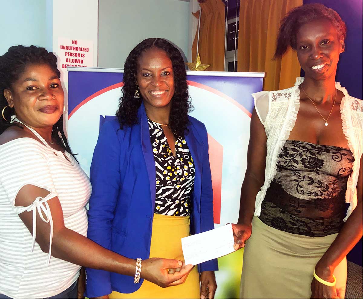 The moms of both players poses with Sales Manager of Demerara Mutual Mrs. Sabina Charles-Kirton.