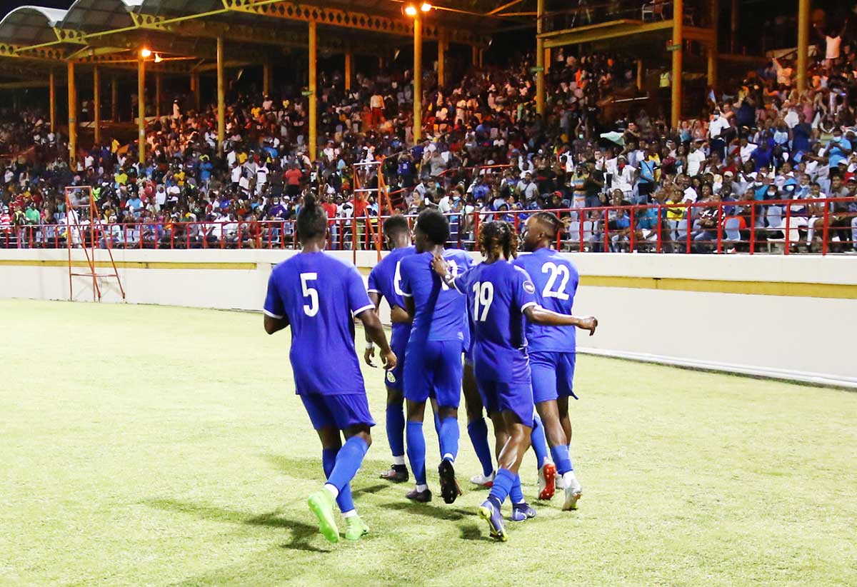 Piton Boyz players acknowledge the crowd support after scoring a goal …