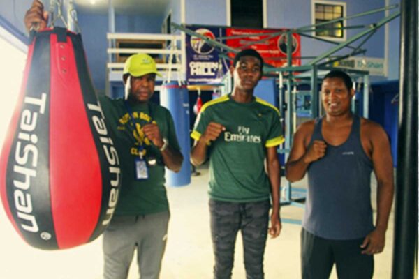 Herve Charlemagne (centre), flanked by Coach Conrad Fredericks (left) and Coach Hilary Dalson (right) at the Vigie Boxing Gym on Tuesday afternoon