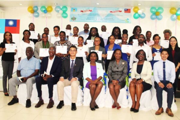 Taiwan’s Ambassador to Saint Lucia, H.E. Peter Chia-yen Chen; Commerce Minister Hon. Emma Hippolyte; facilitator Dr. Keith Nurse and Mr. Martin Weekes; Taiwan Technical Mission officials and other Commerce Ministry officials; and participants pose for a group photo at last Tuesday’s ceremony.