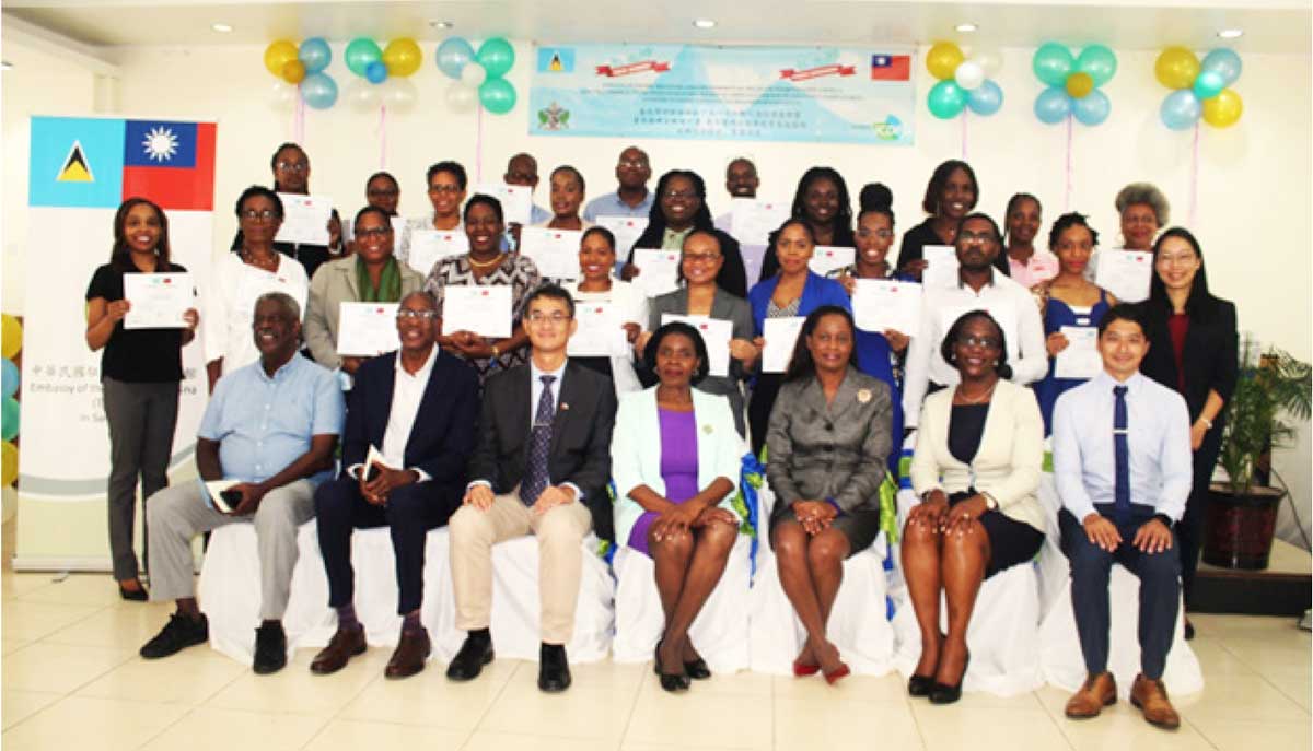 Taiwan’s Ambassador to Saint Lucia, H.E. Peter Chia-yen Chen; Commerce Minister Hon. Emma Hippolyte; facilitator Dr. Keith Nurse and Mr. Martin Weekes; Taiwan Technical Mission officials and other Commerce Ministry officials; and participants pose for a group photo at last Tuesday’s ceremony.