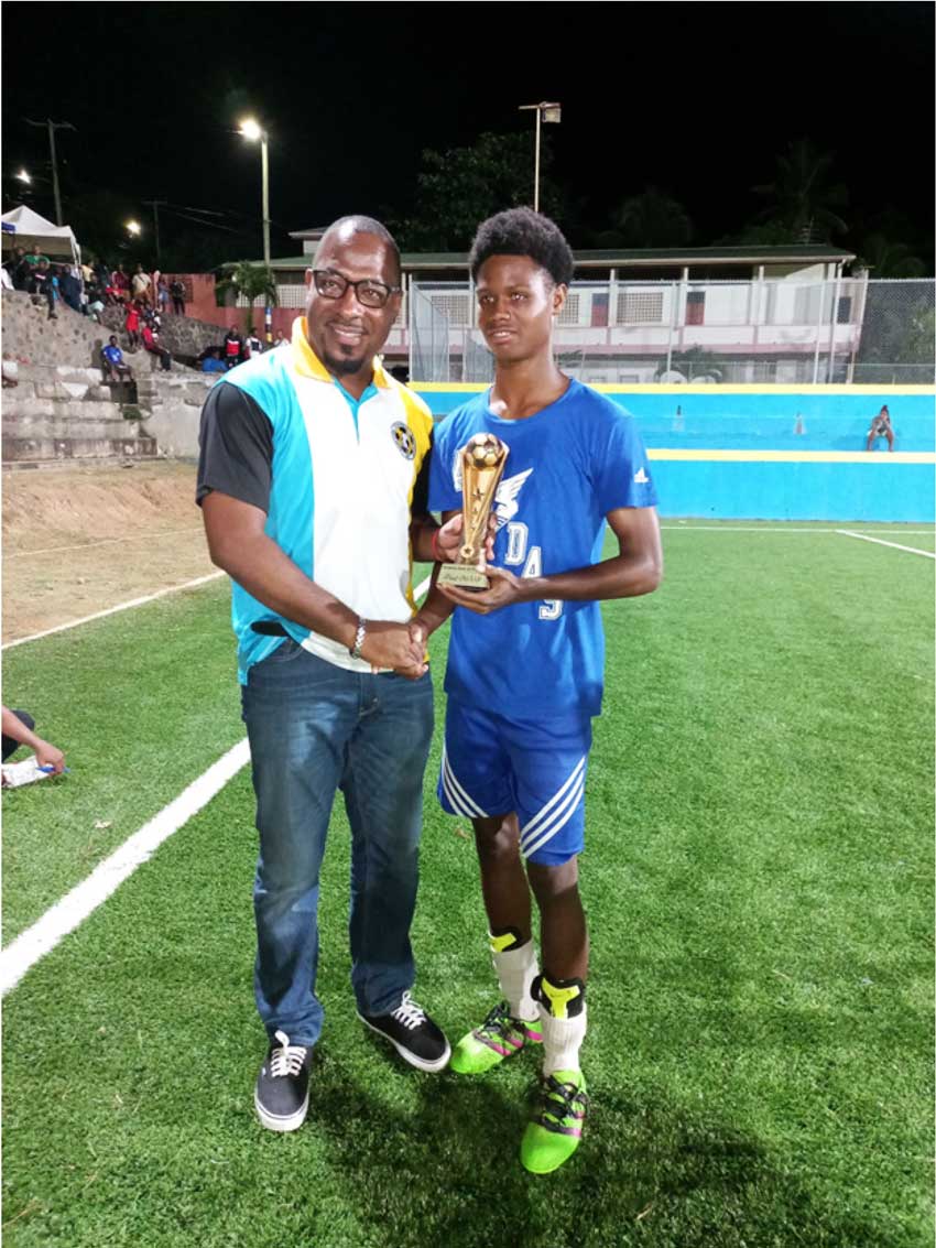 Zackery Harper (Mabouya Valley) collected both the MVP of the tournament and Most Goals scored awards from an SLFA official.