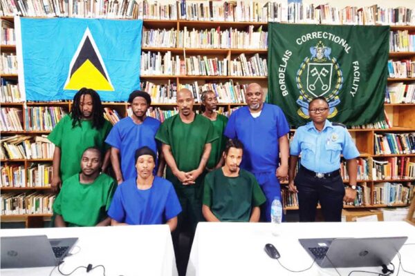 Inmates who participated in the Chess Tournament alongside Officer Yasmin Peters.