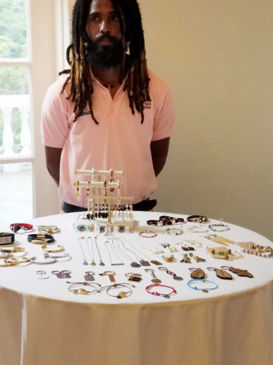 Adam Cadette displays his handmade jewelry craft …