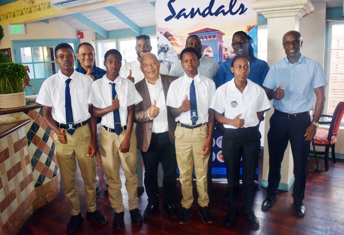 Sandals Resorts managing Director Winston Anderson (center) and other representatives and young players at the Sandals U-19 Cricket media launch.