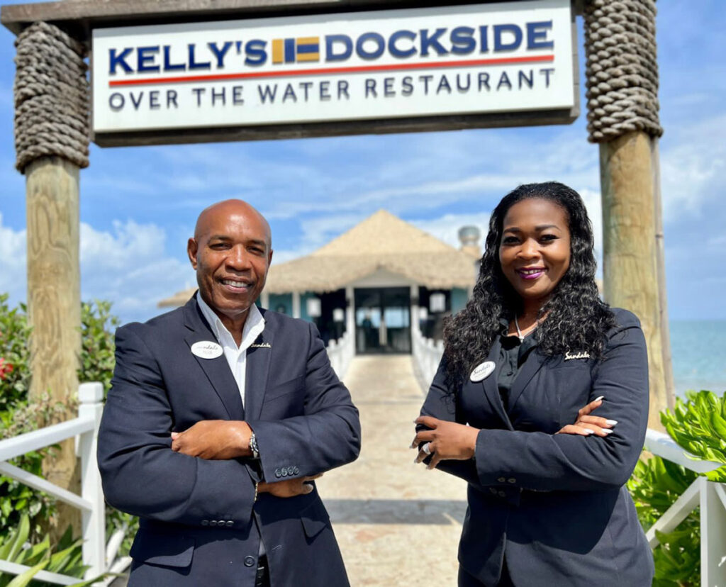 General Manager Filius Laurent and Hotel Manager Rohann Louis on Saint Lucia's Sandals Halcyon's famous over-the-water dockside restaurant at Choc. (PHOTO Courtesy SRI)