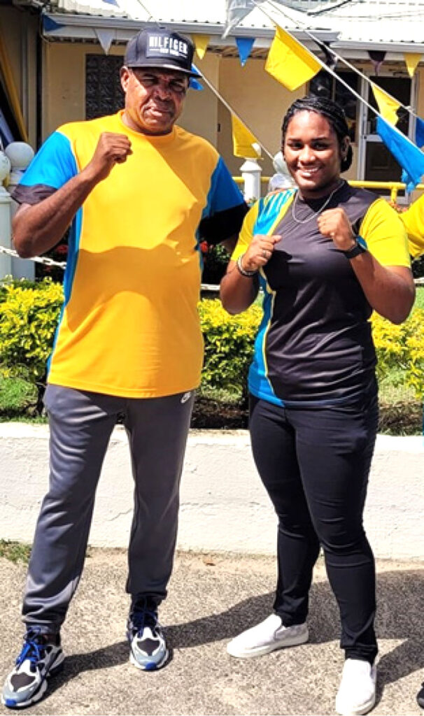 Saint Lucian light heavyweight boxer, Nikaela Khodra, right, with National Head Boxing Coach, Conrad Fredericks.