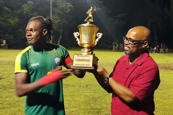 BAYS FC captain collects the Championship Trophy from Castries South East MP Joachim Henry.