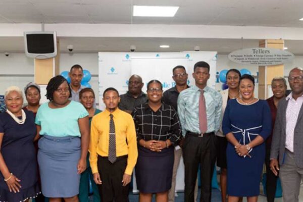 Left to right: Gezella Claxton: Senior Country Lead, Michelle Palmer: Managing Director, YouthLinkers and family, and other members of the executive leadership team.