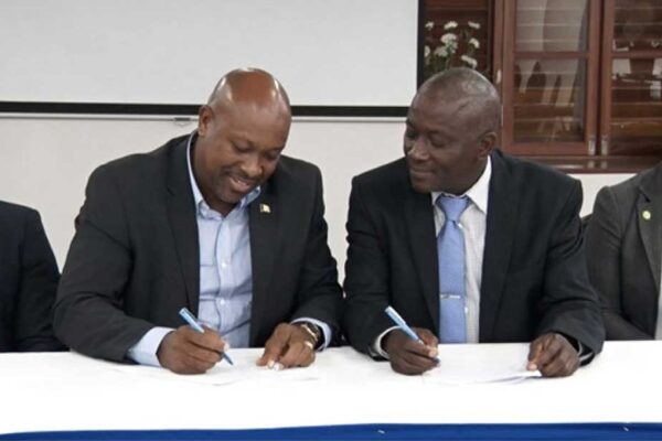 SVG’s Saboto Caesar and Saint Lucia’s Alfred Prospere signing the MOU