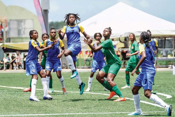 Team Saint Lucia (blue and yellow outfit) in an offensive mode versus Guadeloupe