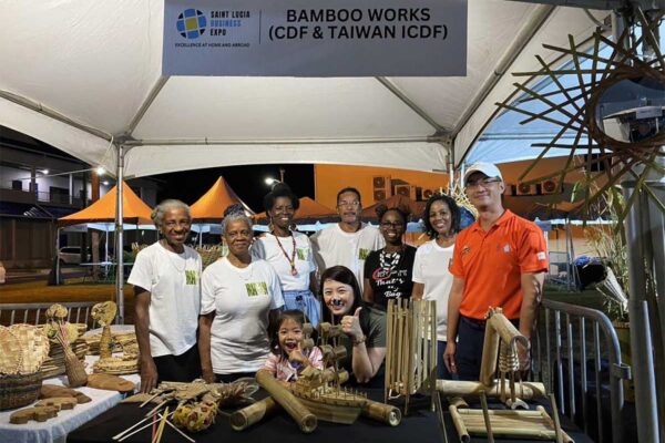 H.E. Peter Chia-Yen Chen, Taiwan’s Ambassador to Saint Lucia, and Mrs. Chen join some of the Bamboo Works workshop participants in their booth at the Taste of Saint Lucia Expo in Rodney Bay.