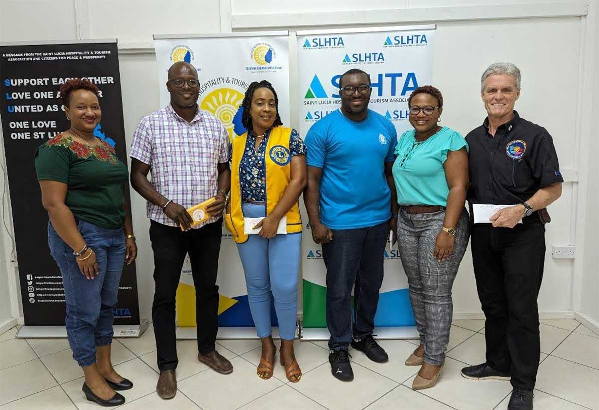 TEF Technical Officer Tamara Amos, PC Cameron Laure, Samantha Joseph, Sergeant Zachary Hippolyte, TEF Programme Manager Donette Ismael and Past President of the Rotary Club of Saint Lucia Konrad Wagner.