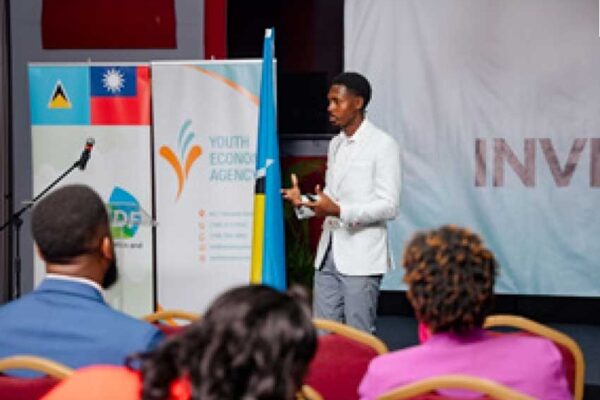 A facilitator tutors young entrepreneurs at the YEA Investment Forum