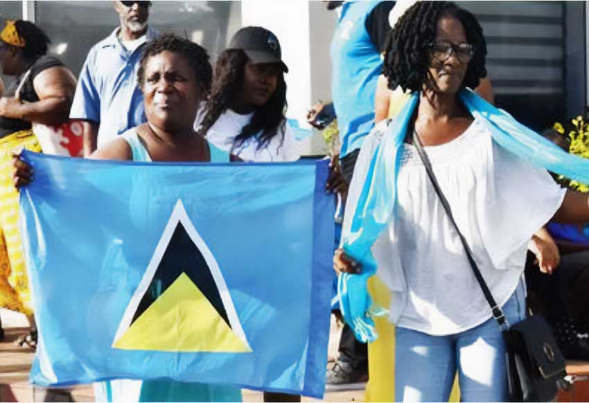 Patriotic Saint Lucians display the flag and national colours