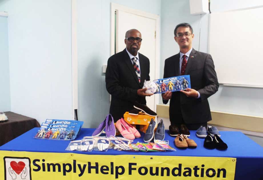 H.E. Peter Chia-Yen Chen, Taiwan’s Ambassador to Saint Lucia, at right, with Hon. Joachim A. Henry, Minister for Equity, Social Justice & Empowerment, during the symbolic handover ceremony held on Thursday morning, January 18, 2024, in the Ministry’s conference room in Castries. 