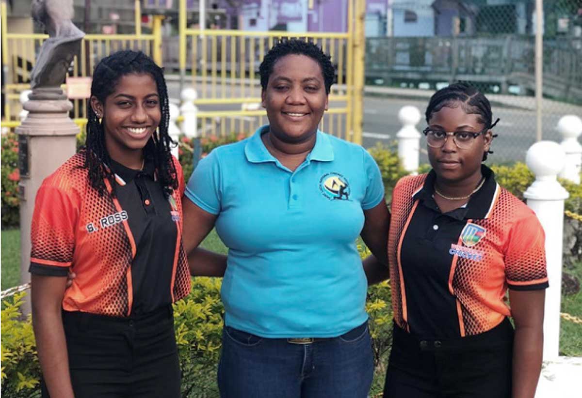Selena Ross (left) and Destiny Edward (right) who participated in the West Indies Under 19 trials pose with SLNCA third Vice President Roseline Preville