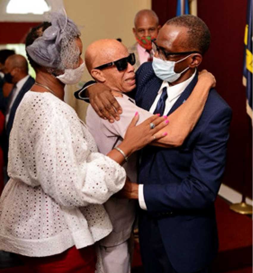 Tom Walcott embraces PM Philip J Pierre at Government House and celebrates Pierre’s elevation to the Prime Ministership of Saint Lucia.